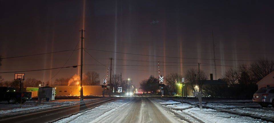 light beams shining through the sky