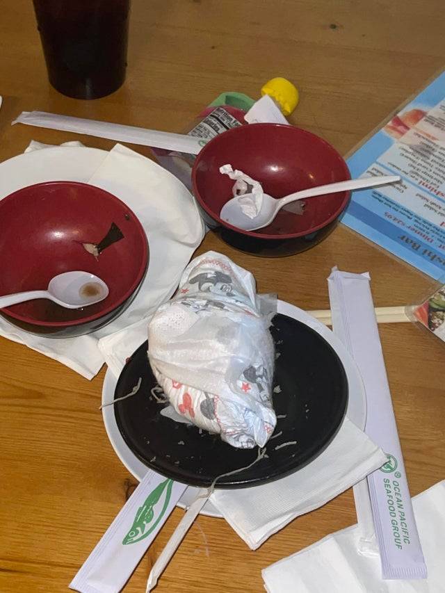 A dirty diaper is left behind by customers on a restaurant table.