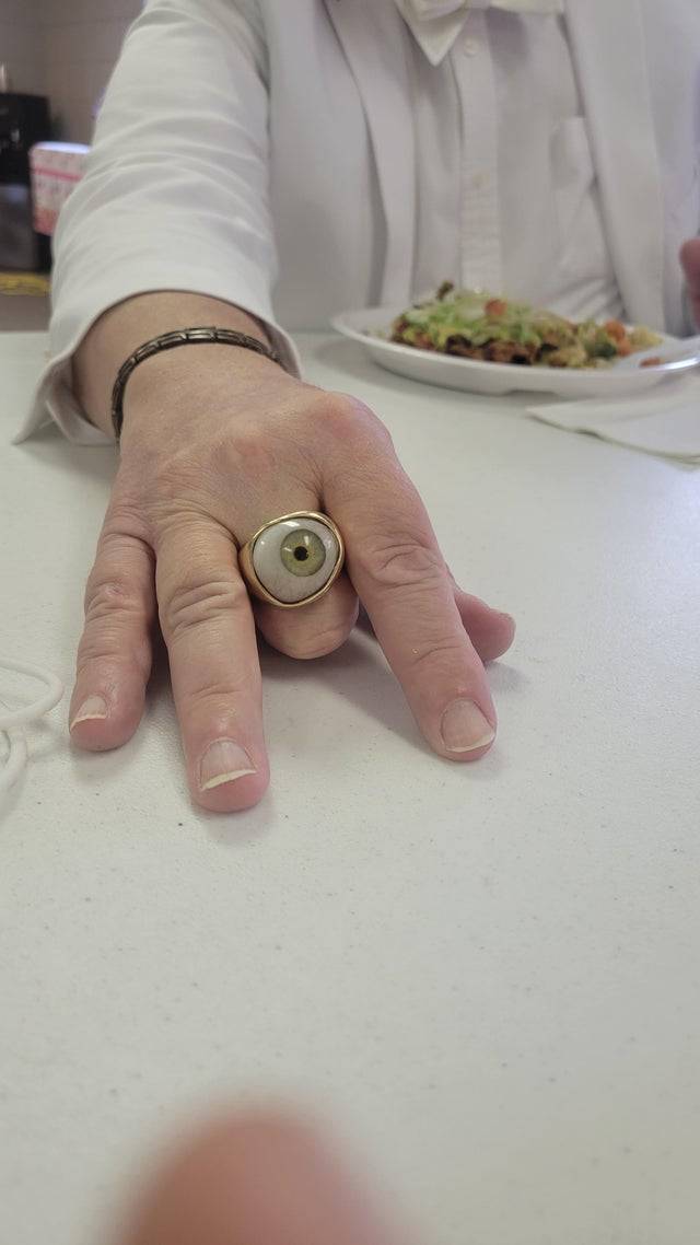 Eyeball on a ring on someone's hand