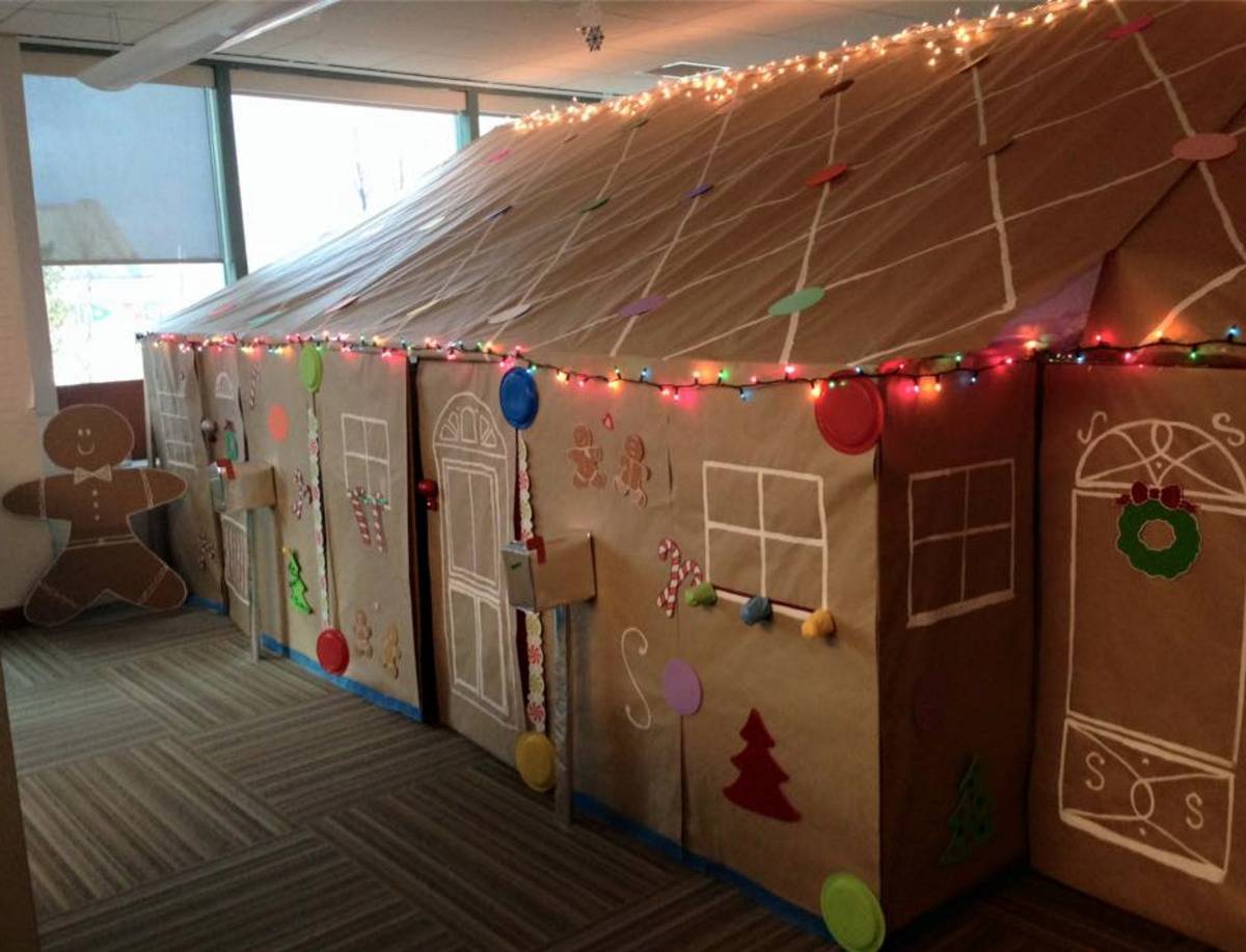 Cubicles made into a large gingerbread house.