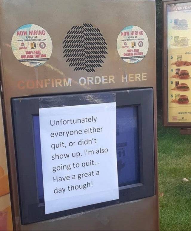 Drive thru with a sign that everyone has quit the restaurant.