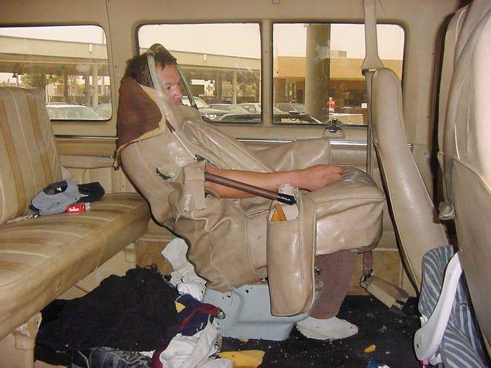 Man disguised as a chair in a van.