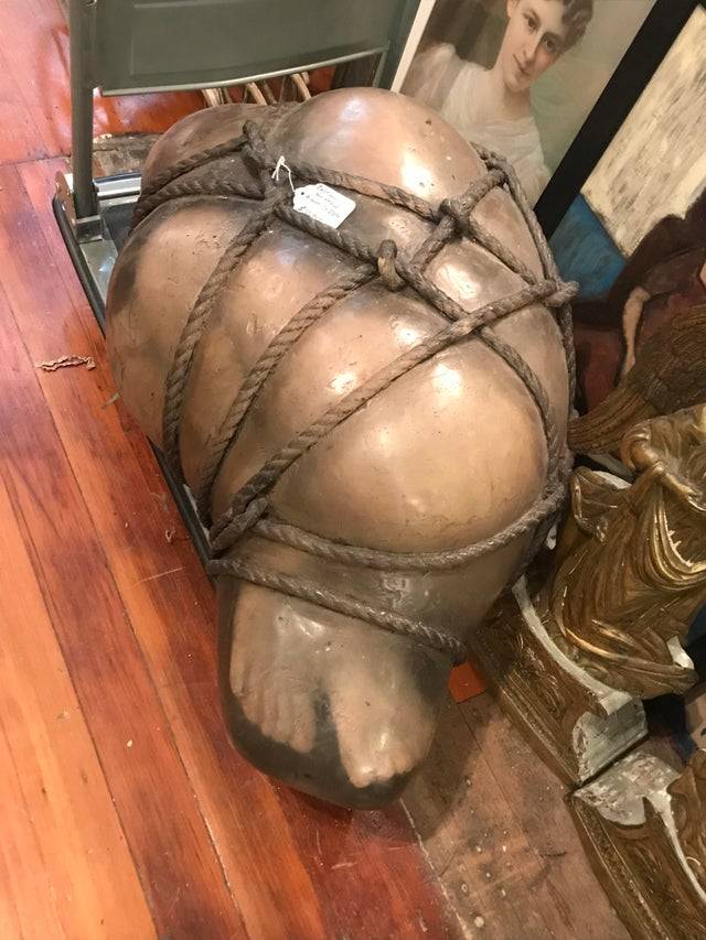 Human looking figure wrapped in rope in a store