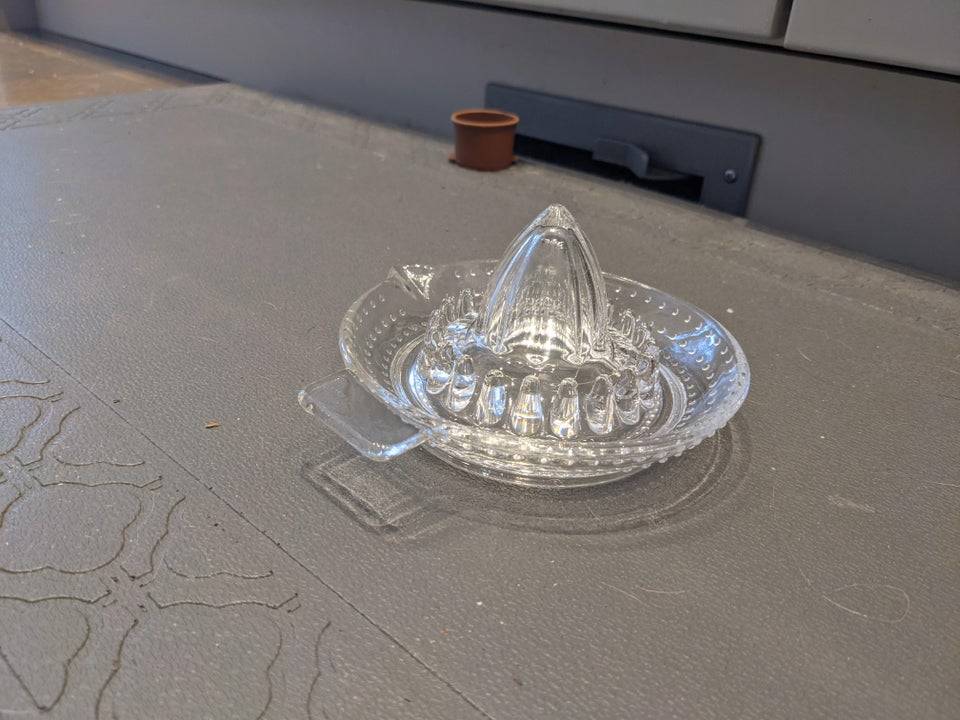 Juicer set upright on kitchen floor mat