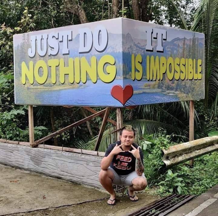 Inspirational sign that doesn't read properly because it's installed on a corner.
