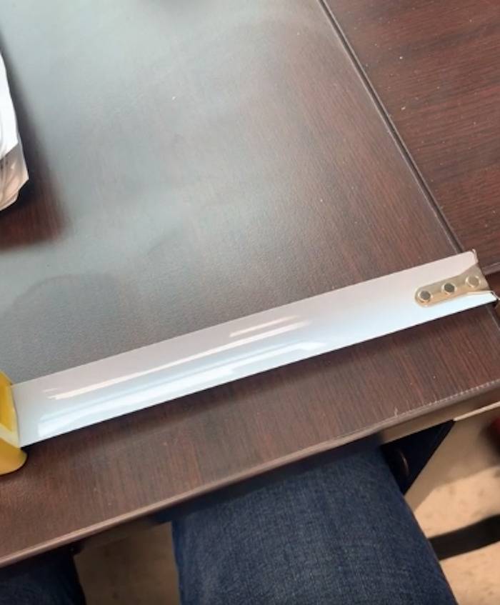 A blank measuring tape with no markings or measurements on it.