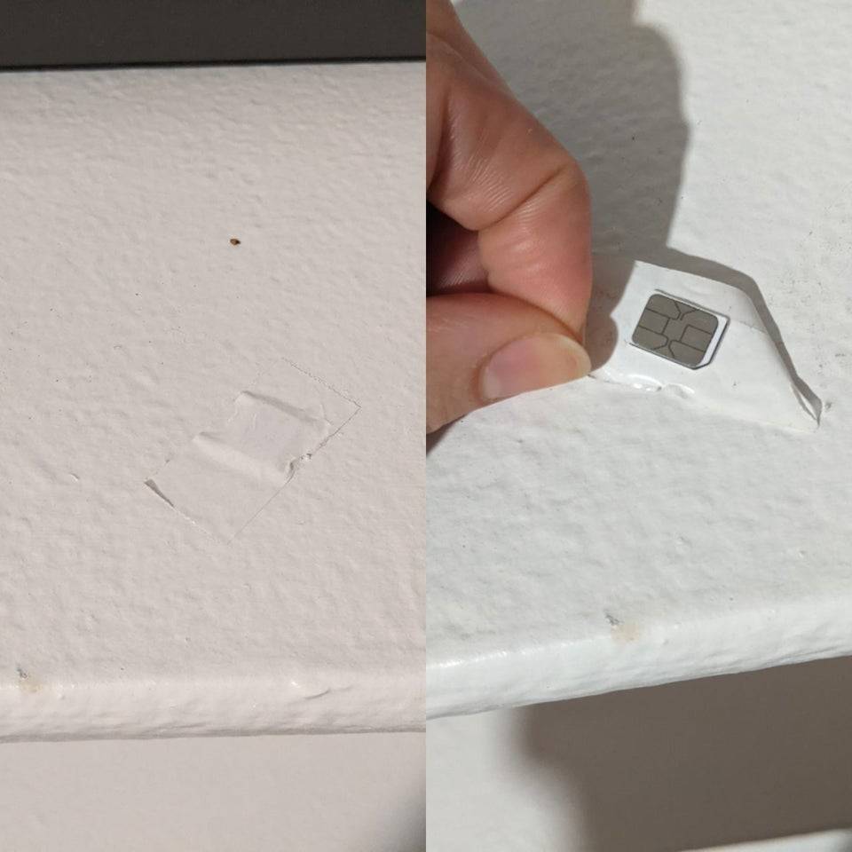 Memory chip under a piece of tape on the wall.