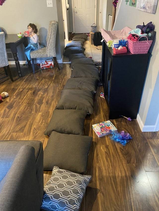 Pillows laid across the floor all the way to the door