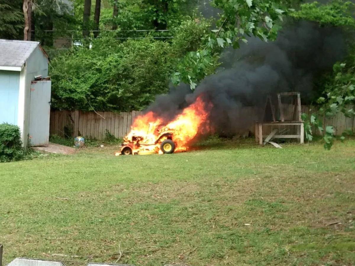 lawnmower engulfed in flames