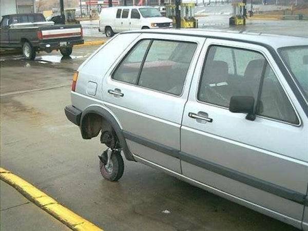 SpVery small wheel being used as a spare tire