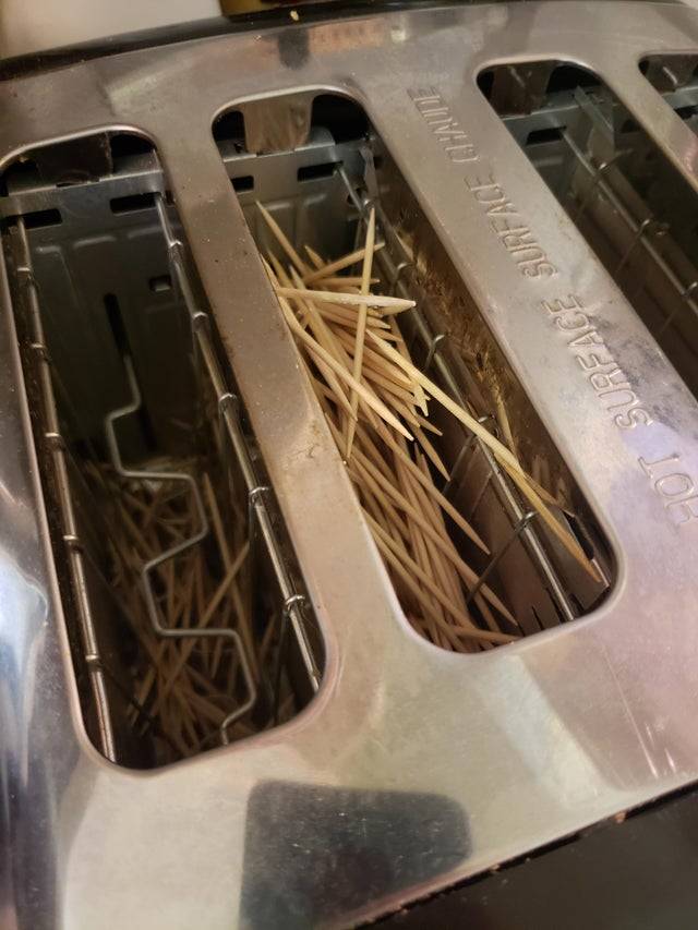 Toaster filled with wooden tooth picks