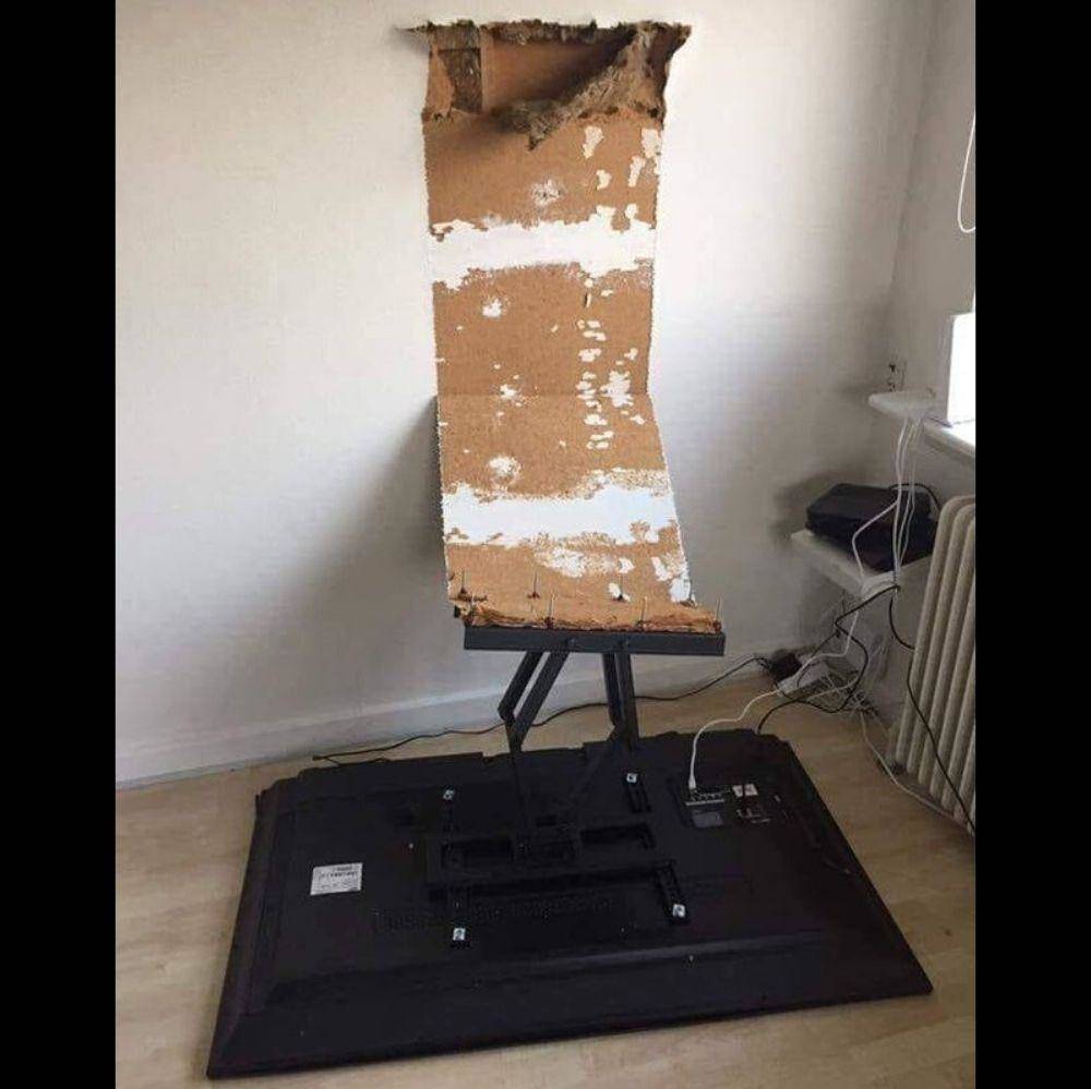 Tv falls off wall and peels off wallpaper