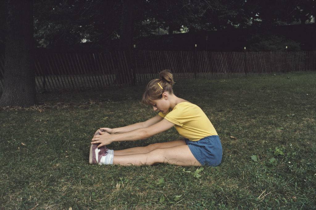 A woman stretching after a workout