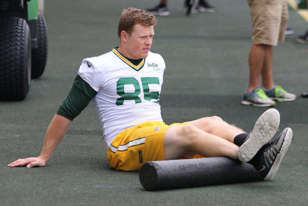 Green Bay Packers tight end Beau Sandland works with a foam roller