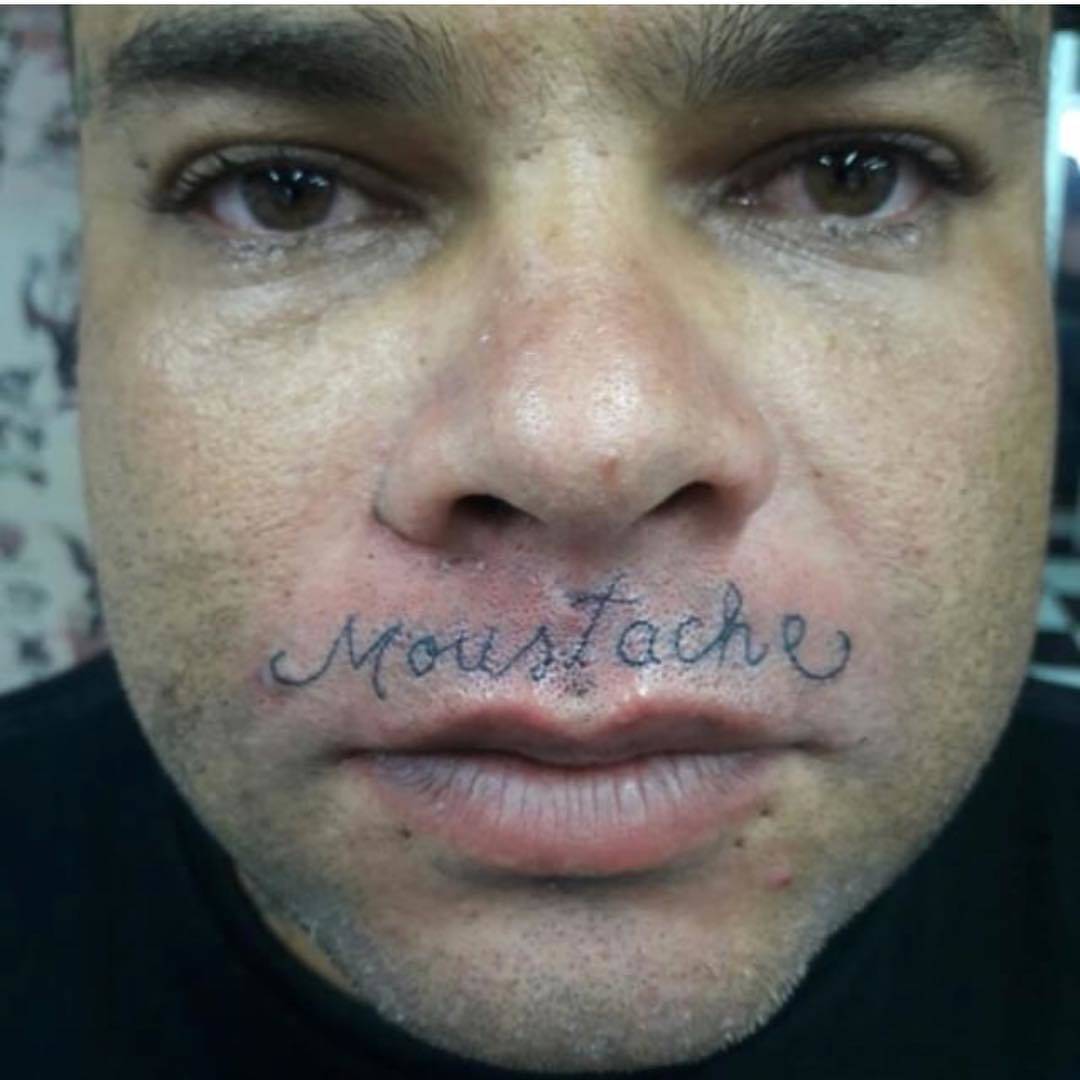 guys gets mustasche tatted on his lip