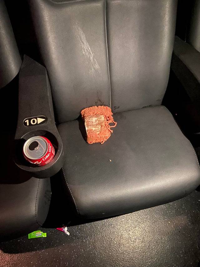 Raw ground beef on movie theater chair