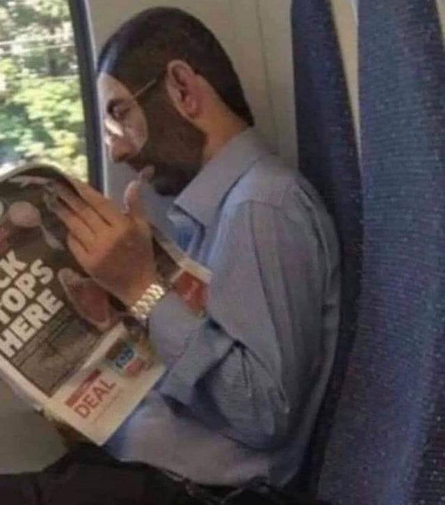 Man with painted-on beard rides public transit