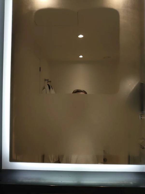 Fogged up hotel mirror 