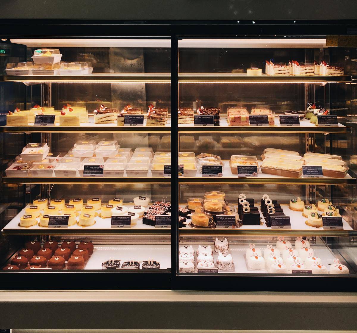 Baked goods inside a grocery store display.