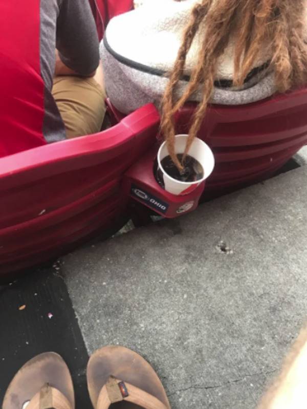 Hair in a cup of soda at a sporting event.