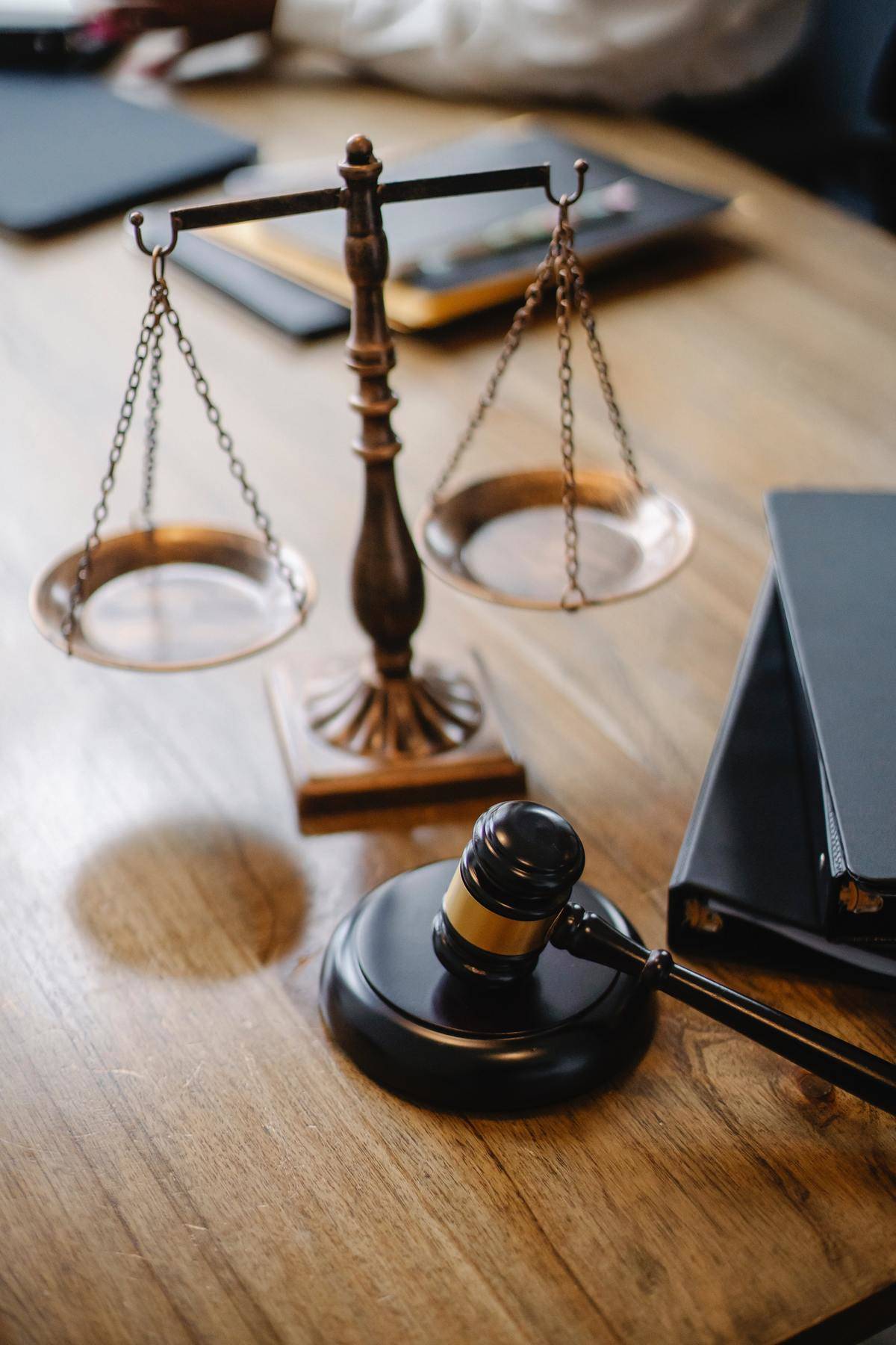 Legal gavel on a desk next to scales
