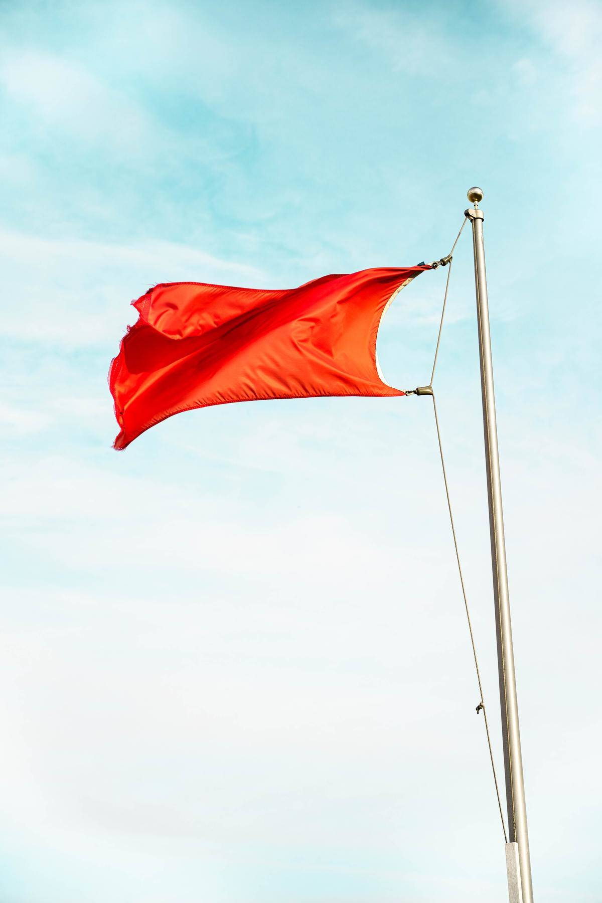 Red flag waving in the wind