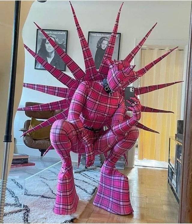 Person wearing pink plaid cosplay spike suit 
