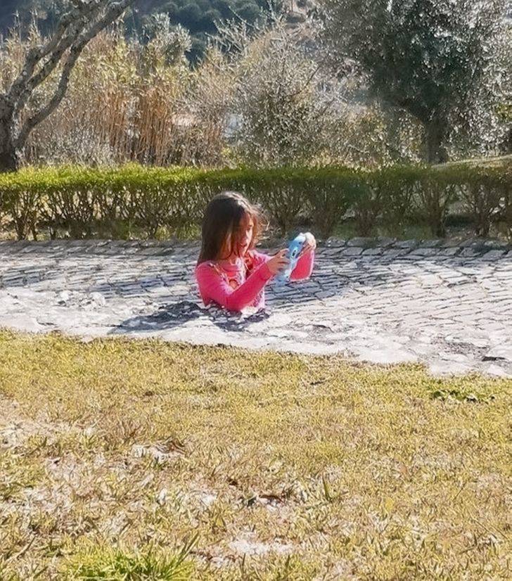 girl in ground somehow