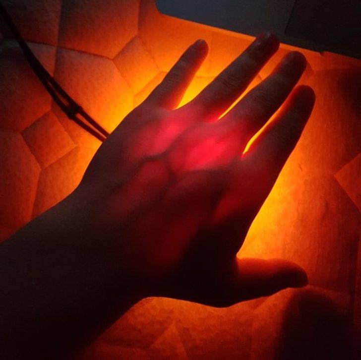 light through hand of human