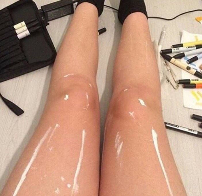 wet paint or shiny legs on lady