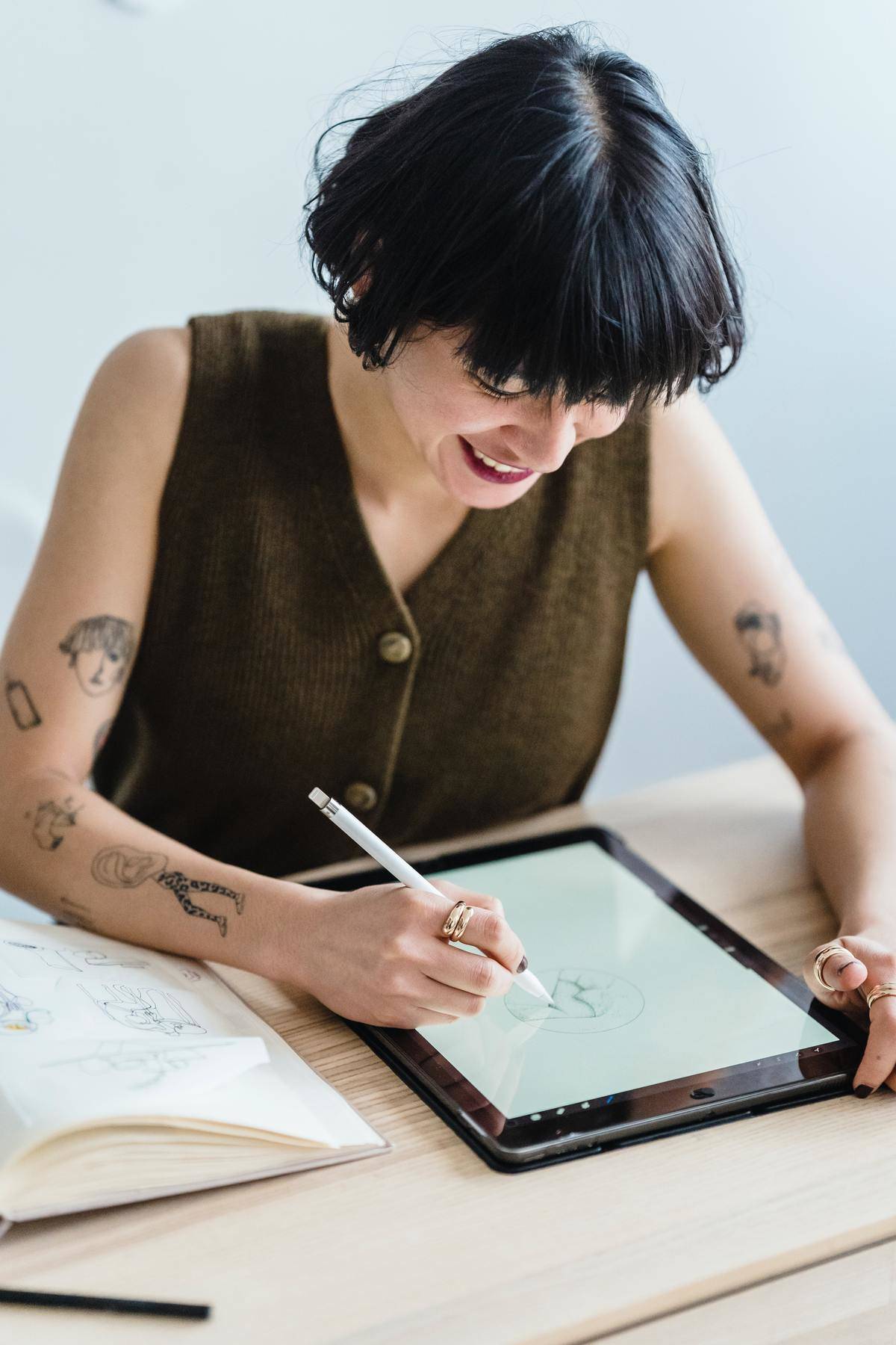 Woman drawing on her digital tablet
