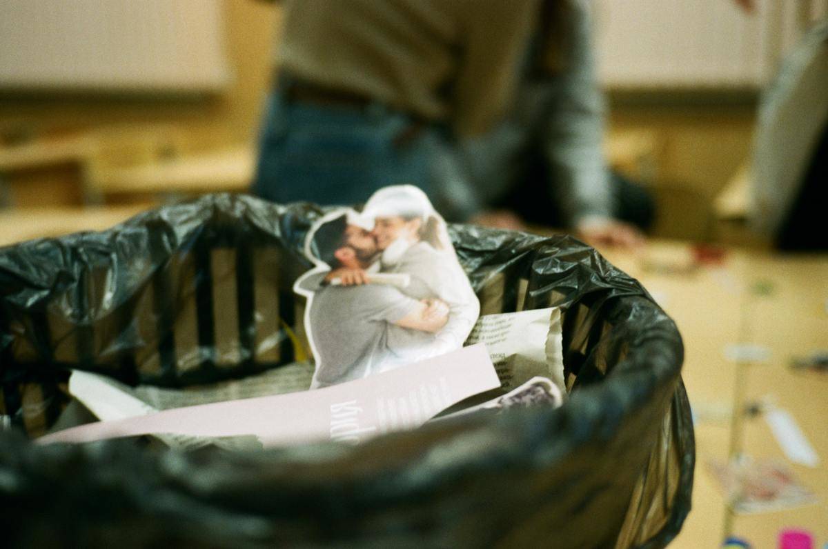 Picture of couple kissing tossed in garbage can