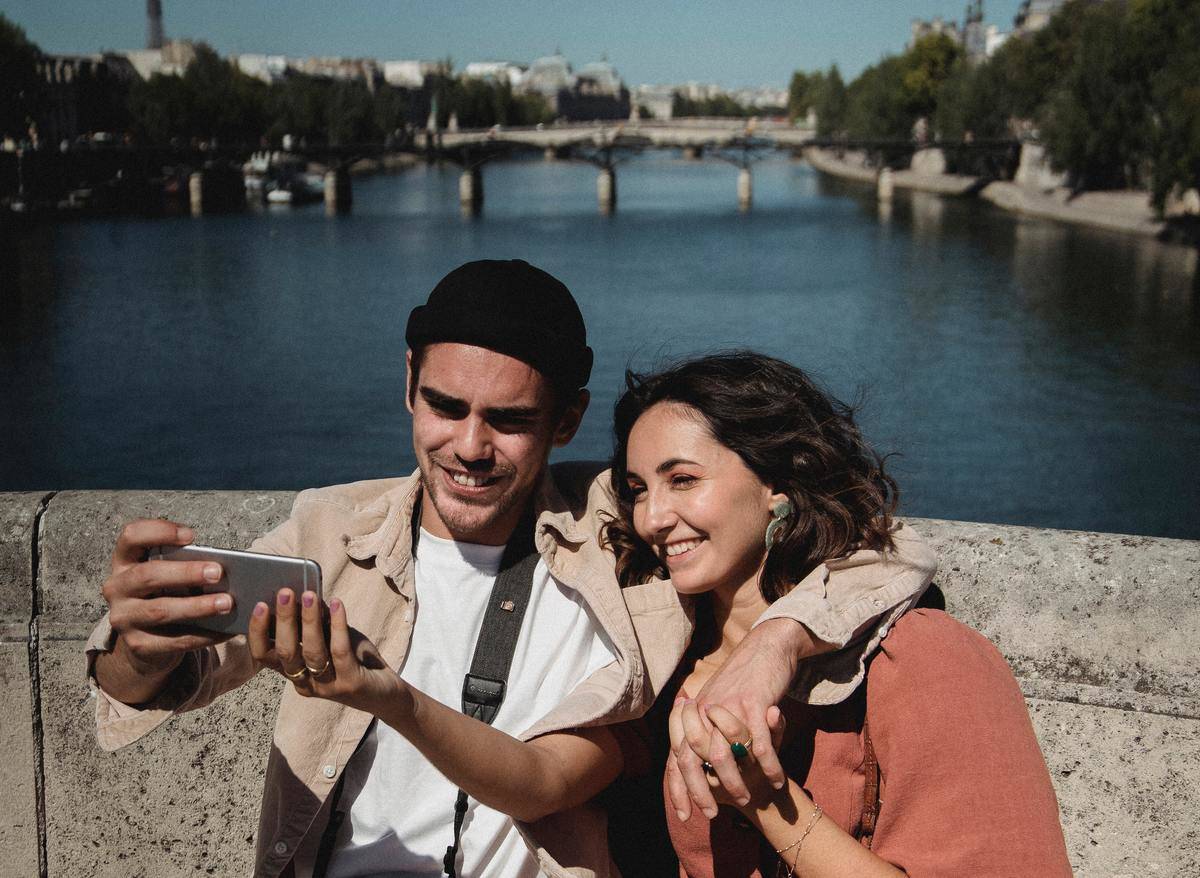 Couple taking selfie over canal 