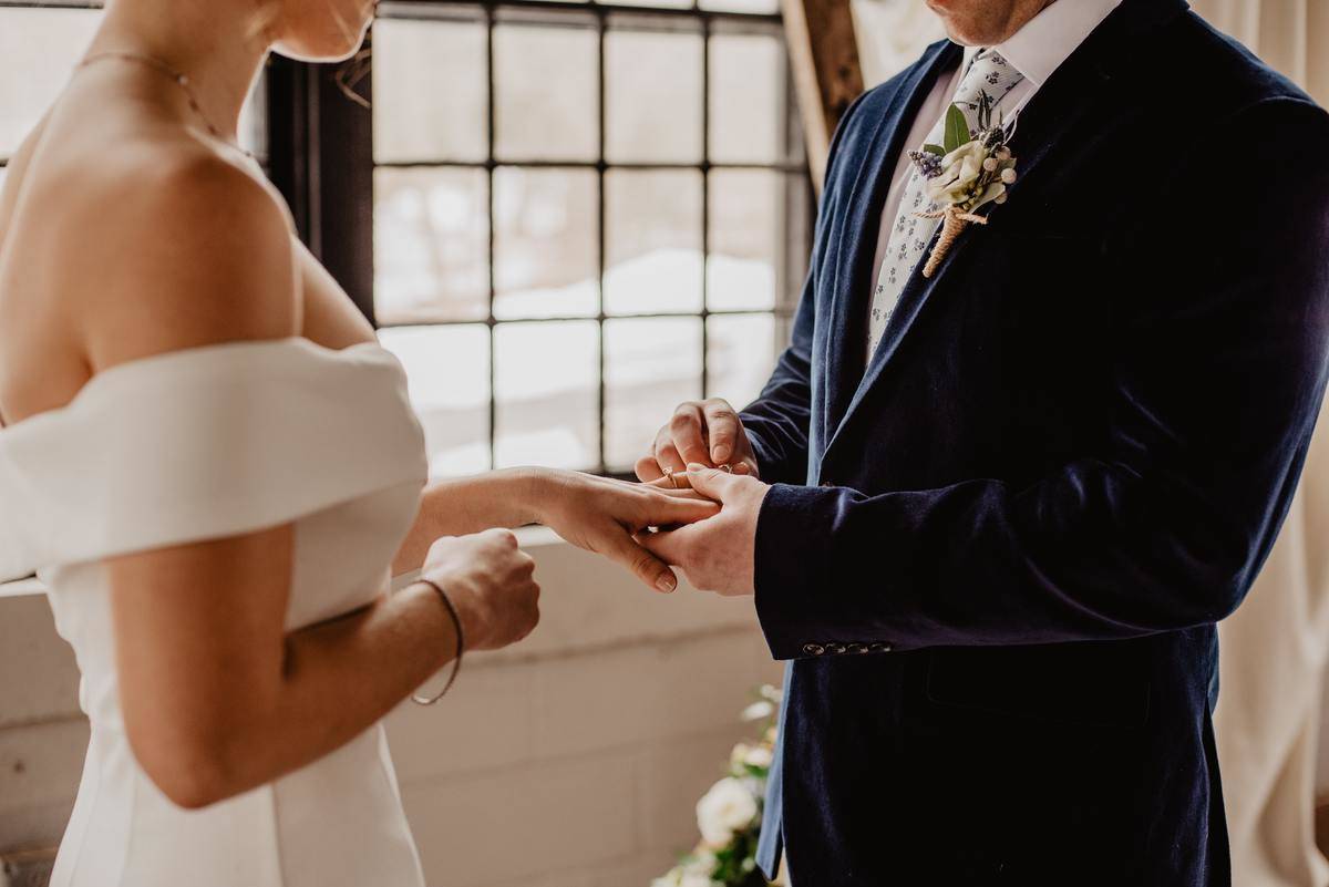 Bride and groom exchanging rings at wedding ceremony