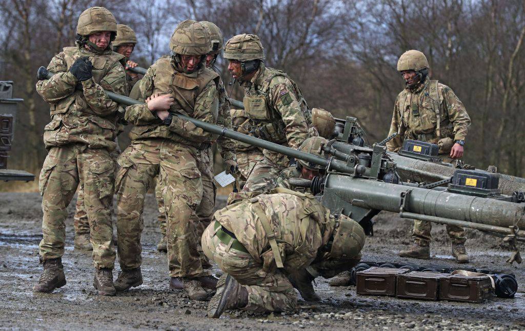 British soldiers load missile together