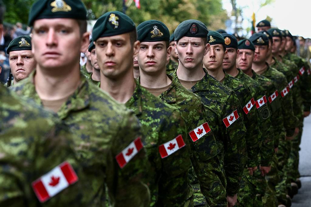 Canadian soldiers march in line