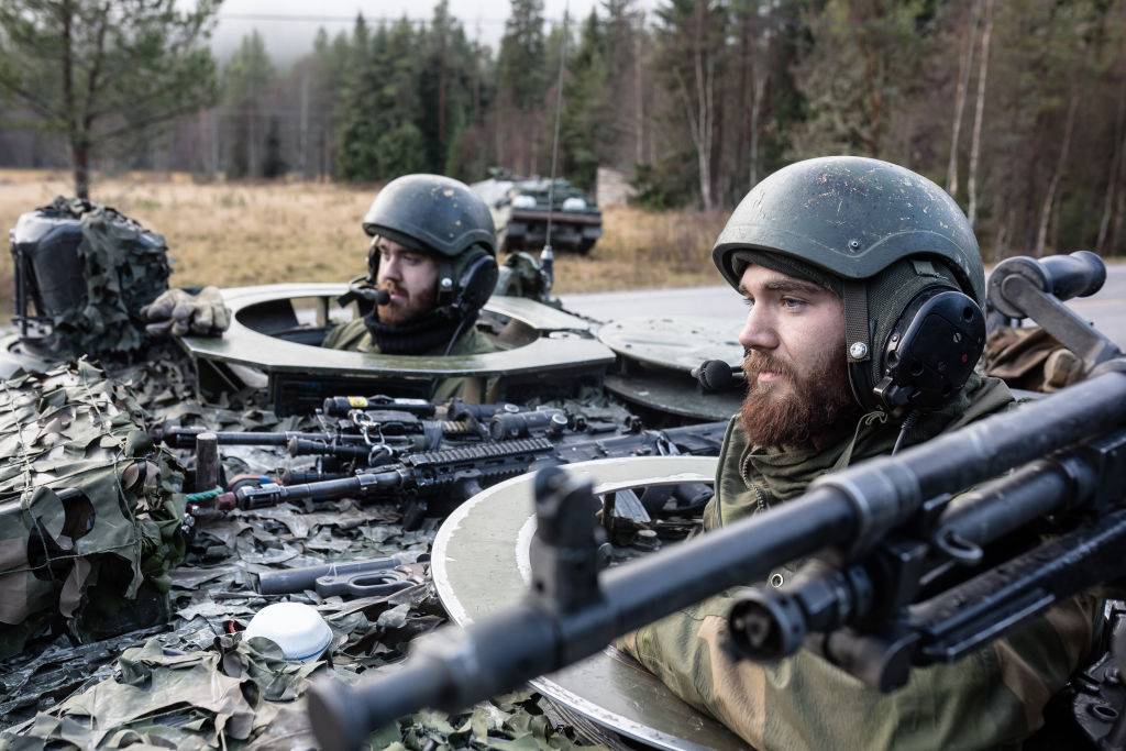 Norwegian soldiers in tank run field operations