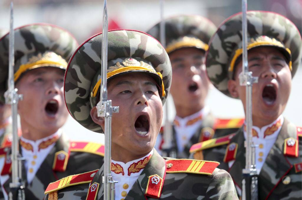 North Korean soldiers shout during military demonstration