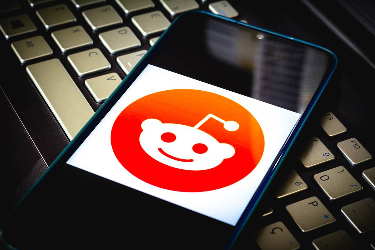 In this photo illustration the Reddit logo seen displayed on...
