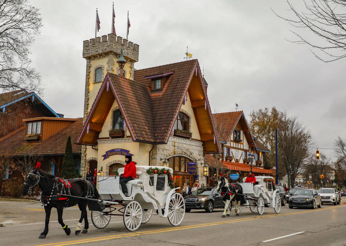 FRANKENMUTH ,U.S., Nov. 30, 2019 -- Two horse-drawn carriages are seen in the Bavarian-themed town of Frankenmuth in Michigan, the United States, on Nov. 29, 2019.