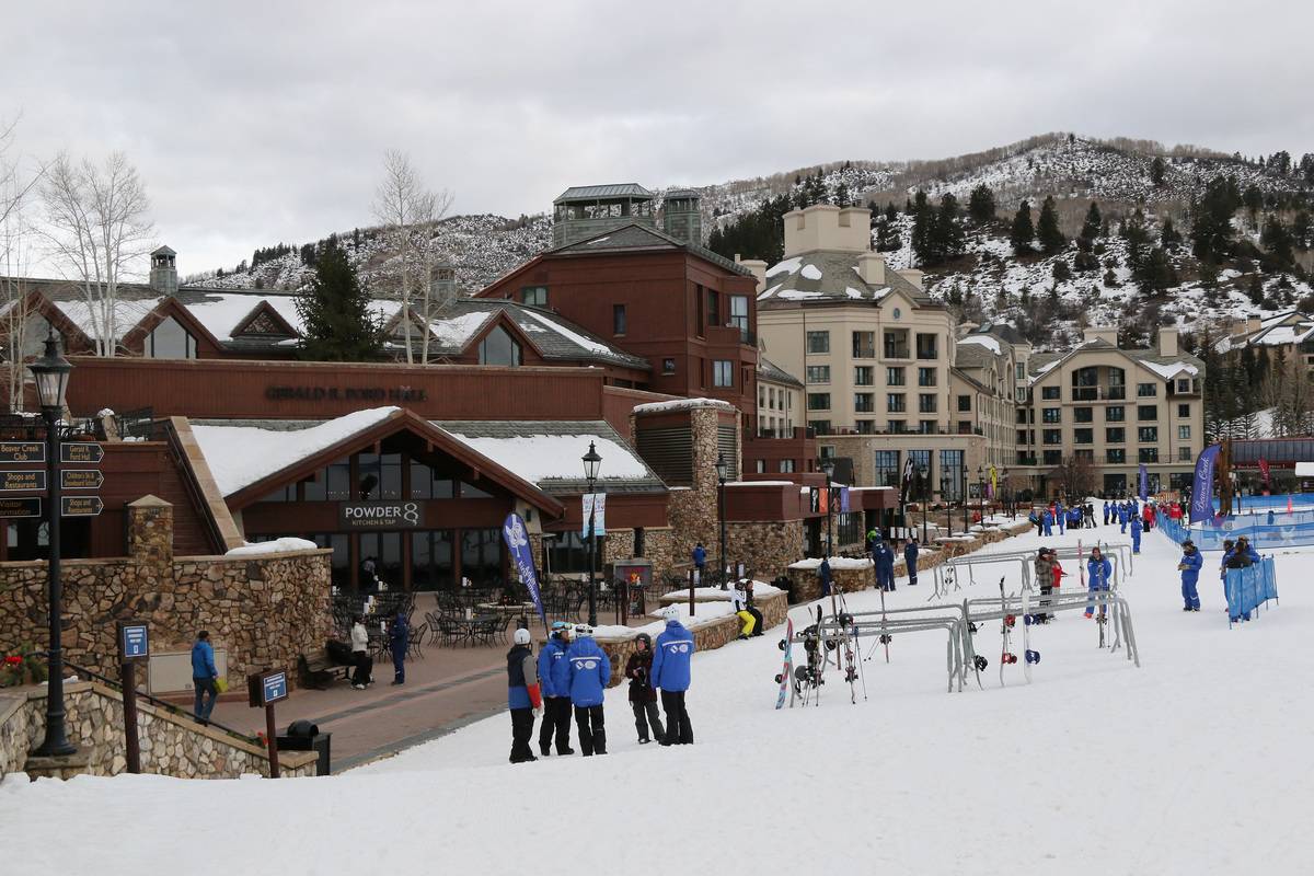 Skiers visit the village in Vail Colorado