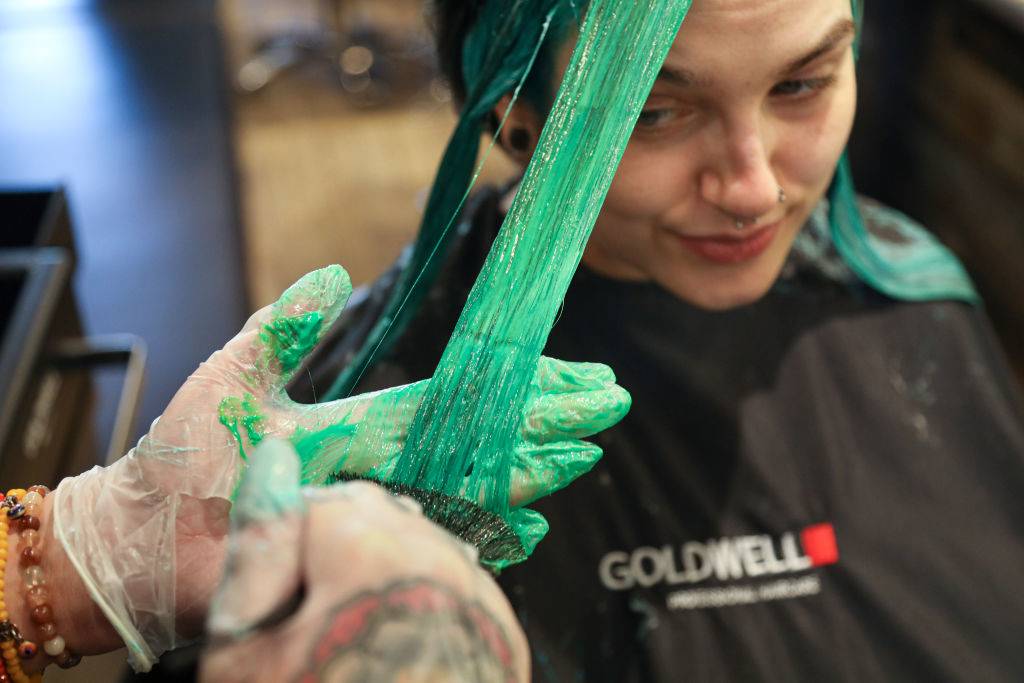 Woman getting hair dyed