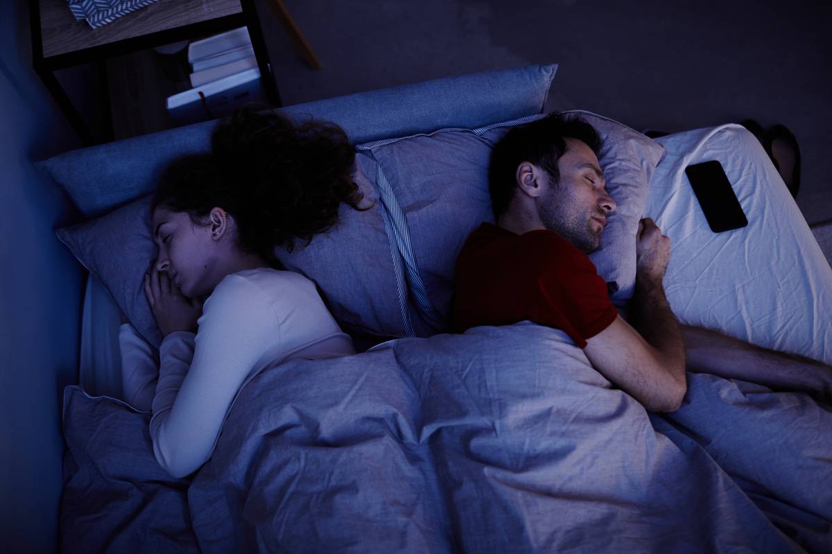young-couple-sleeping-in-bedroom-2022-10-27-20-10-45-utc