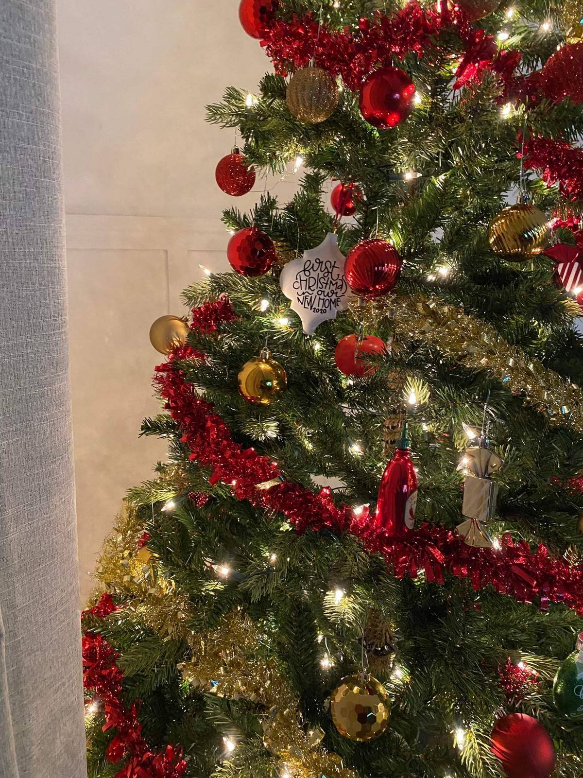 Christmas tree with tomato snuck among its decorations