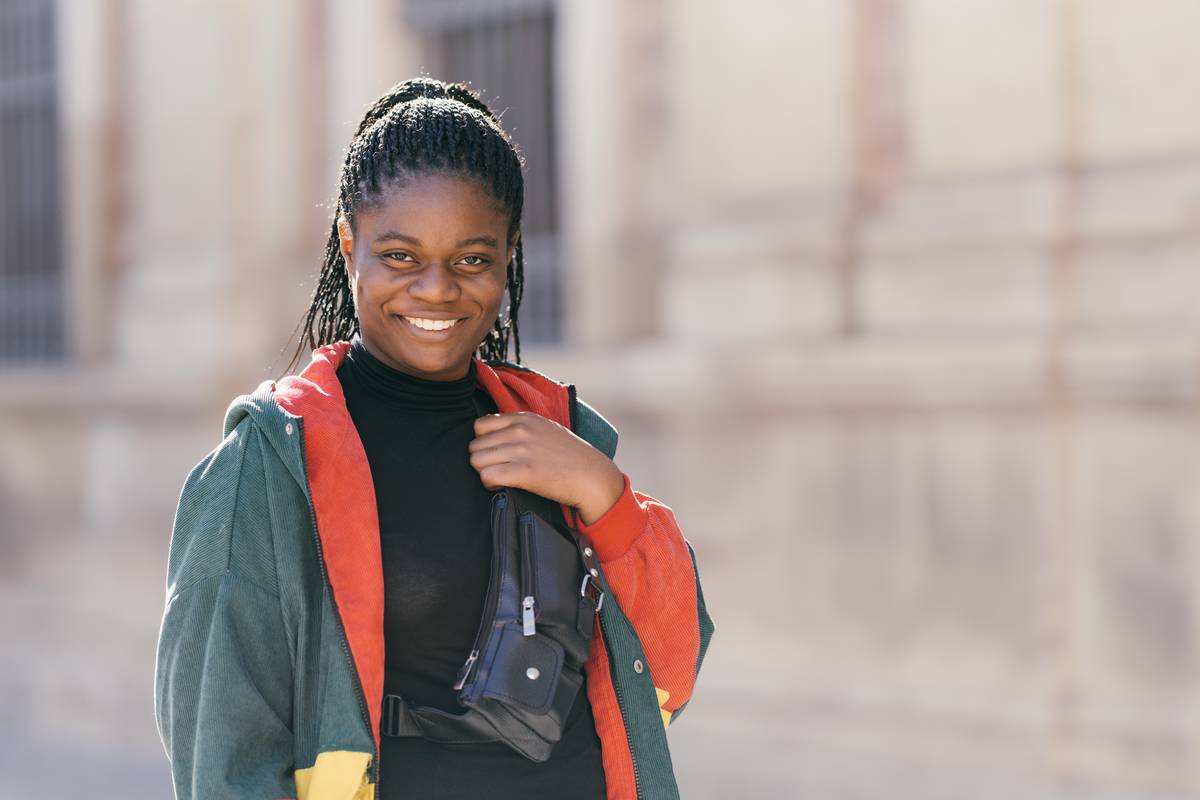 african-woman-with-a-fanny-pack-smiling-at-the-cam-2022-05-10-06-45-33-utc