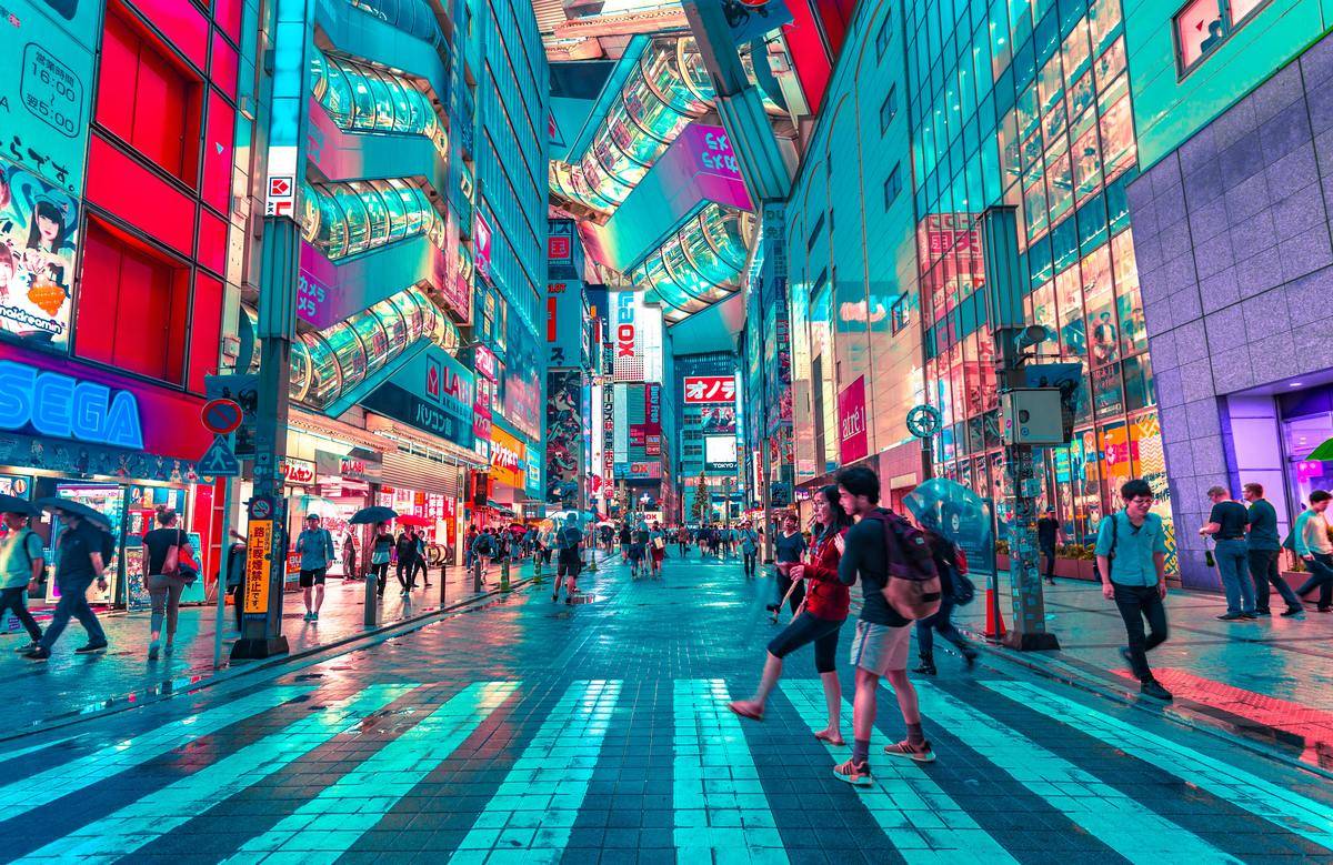 People walking through the multi-colored streets of Tokyo, Japan