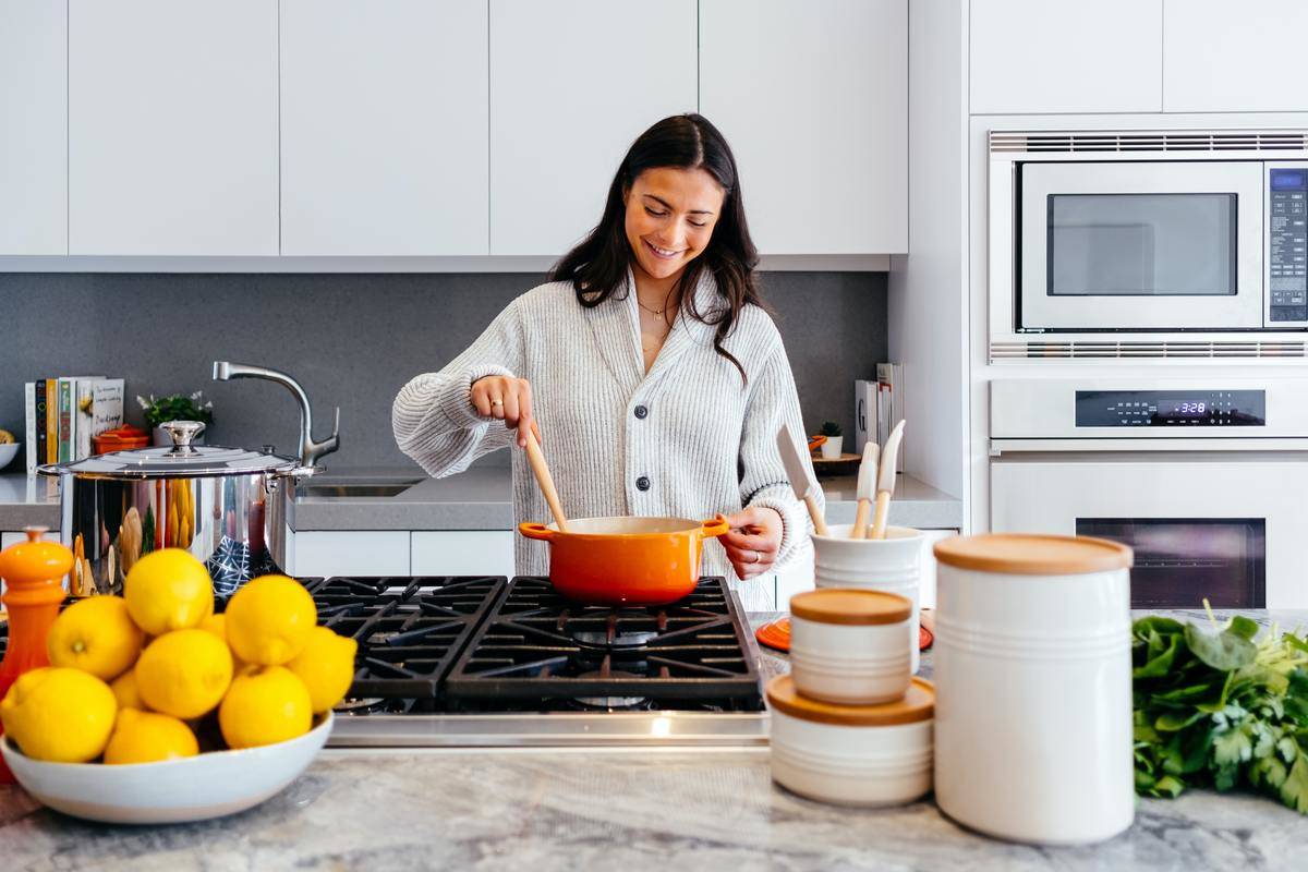 woman cooking on a stove