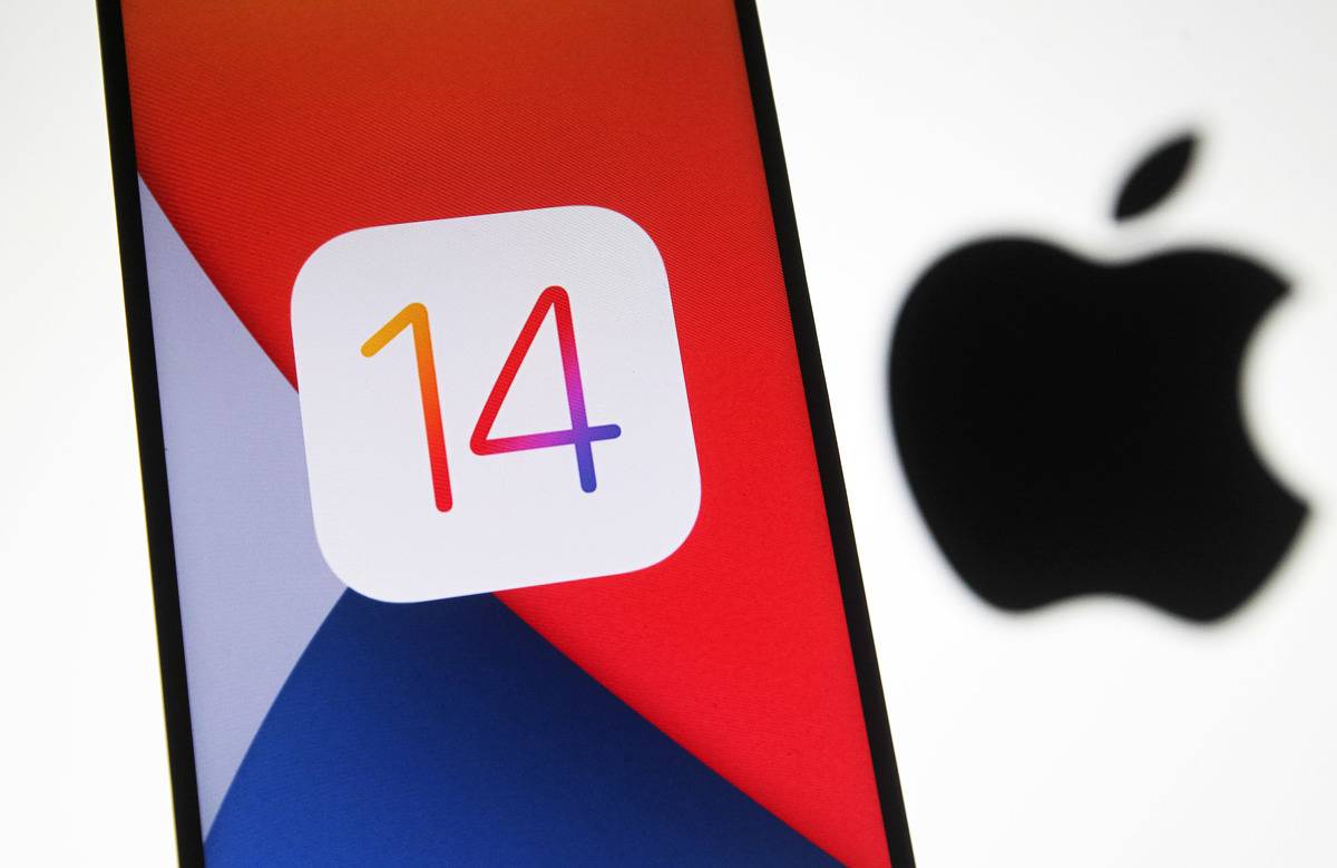 In this photo illustration the iOS 14 logo of the iOS mobile...