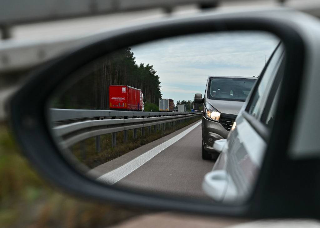 a van in view of a rearview mirror