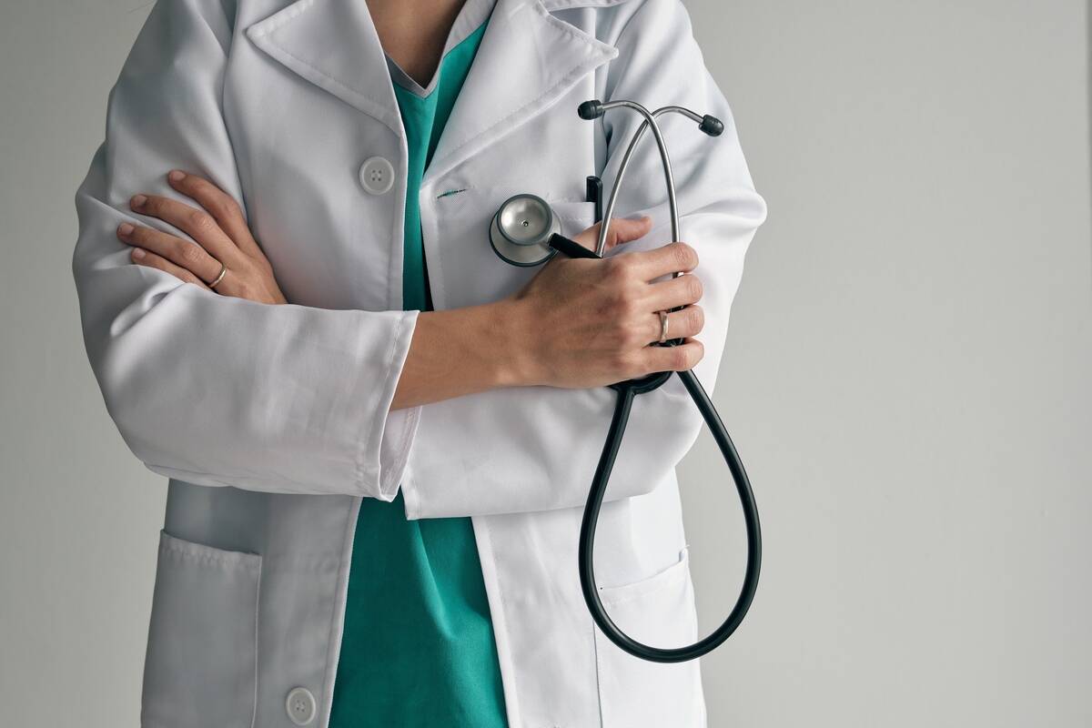 crop-doctor-in-medical-robe-with-stethoscope-2021-10-21-02-30-34-utc